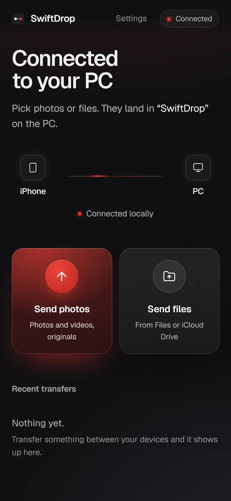 The iPhone connected to the PC, with Send photos and Send files tiles
